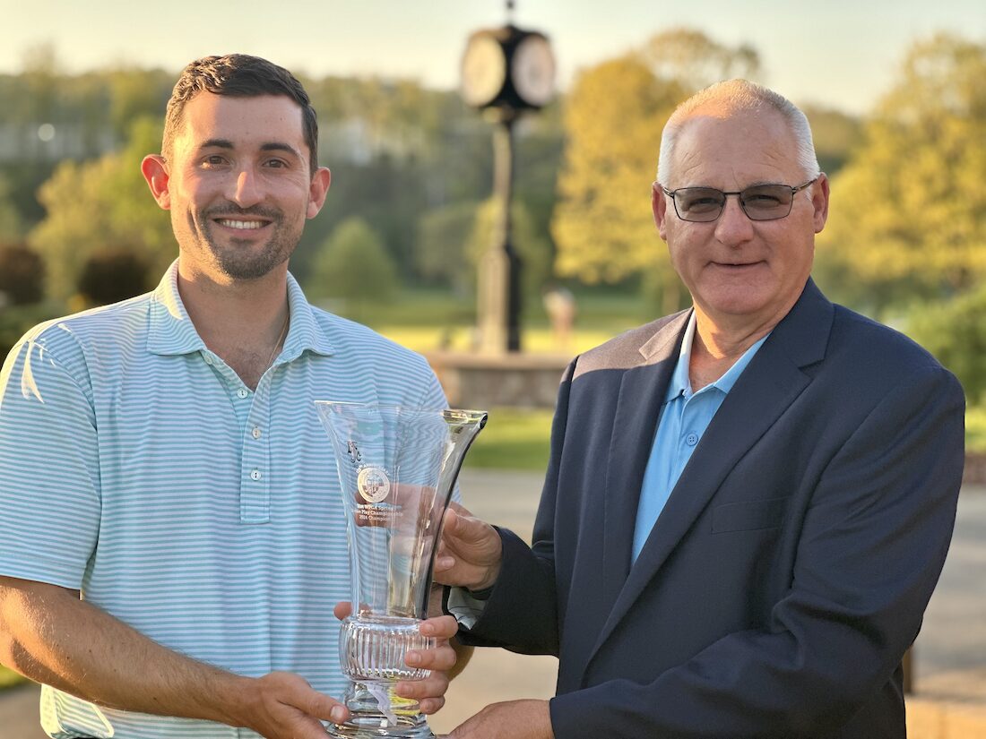 Kevin O'Brien receives the trophy from WPGA President, Ken Flisek